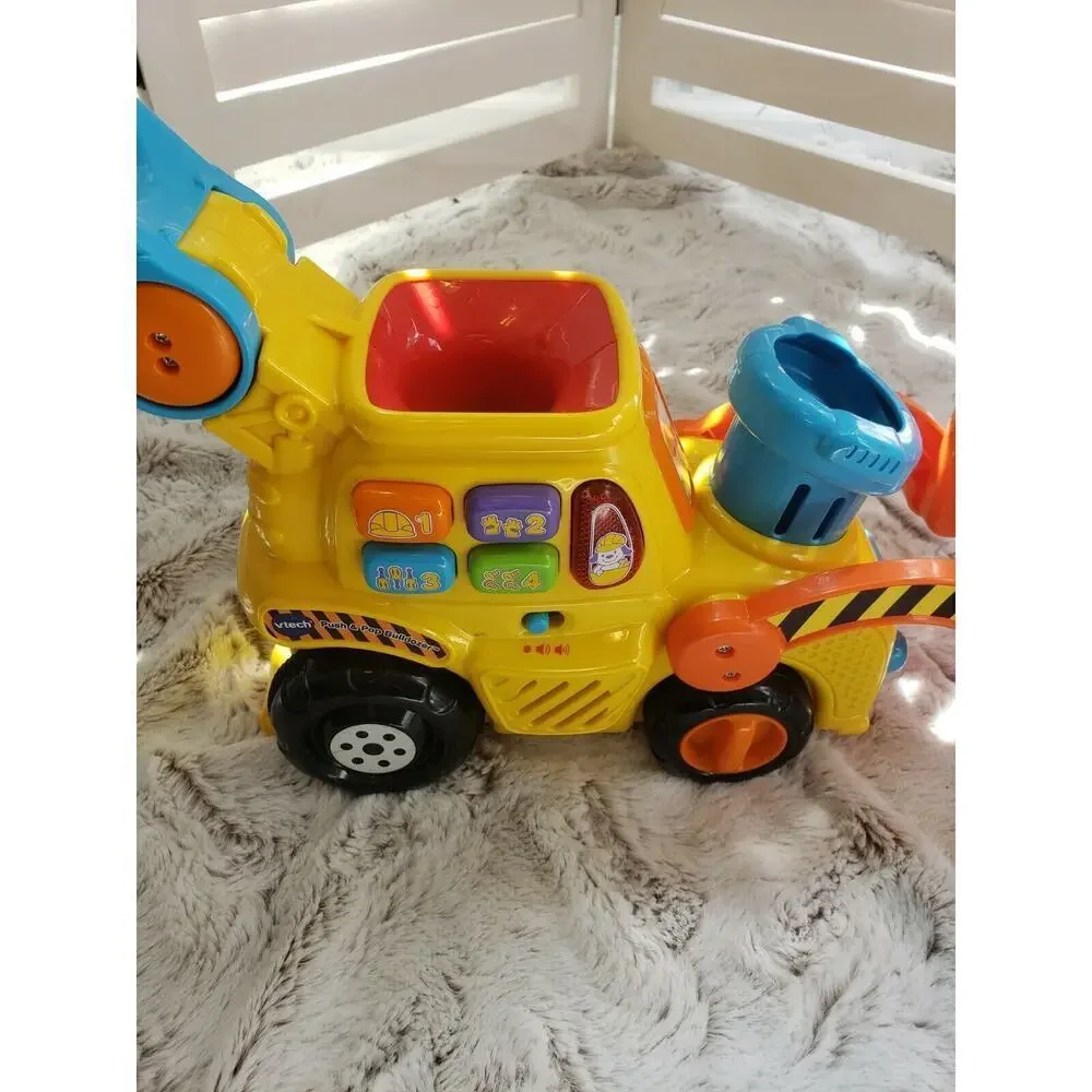 V TECH PUSH AND POP MUSICAL BULLDOZER